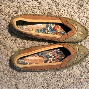 Green and tan leather loafers